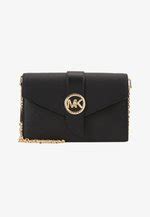 michael kors charmmd xbody|Michael Kors handbags.